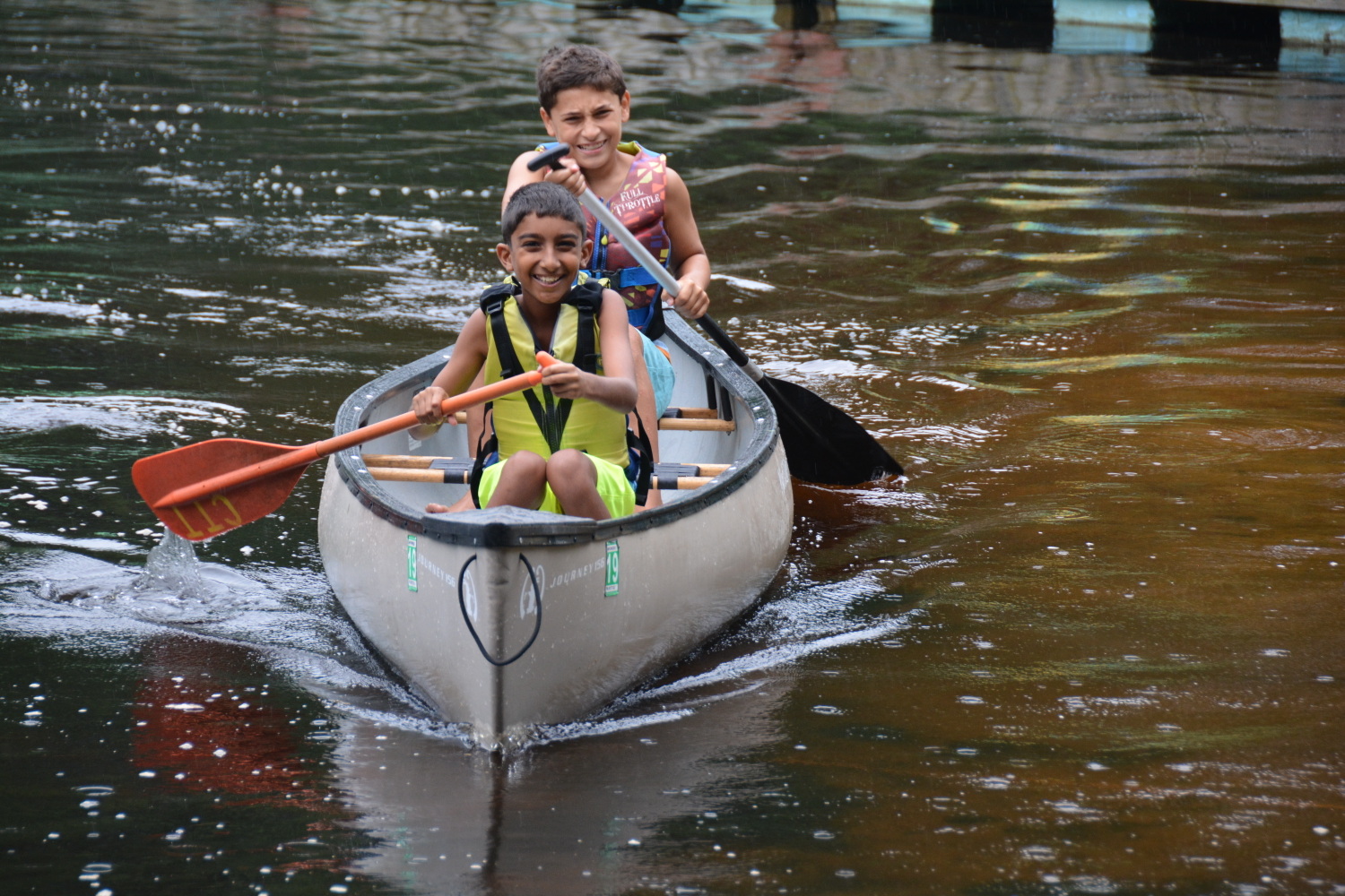 Campers rowing in a canoe