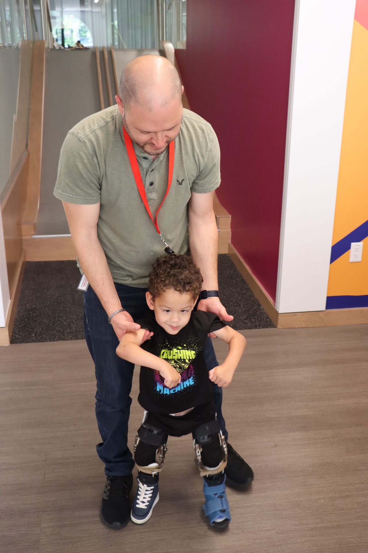 Father helping son walk