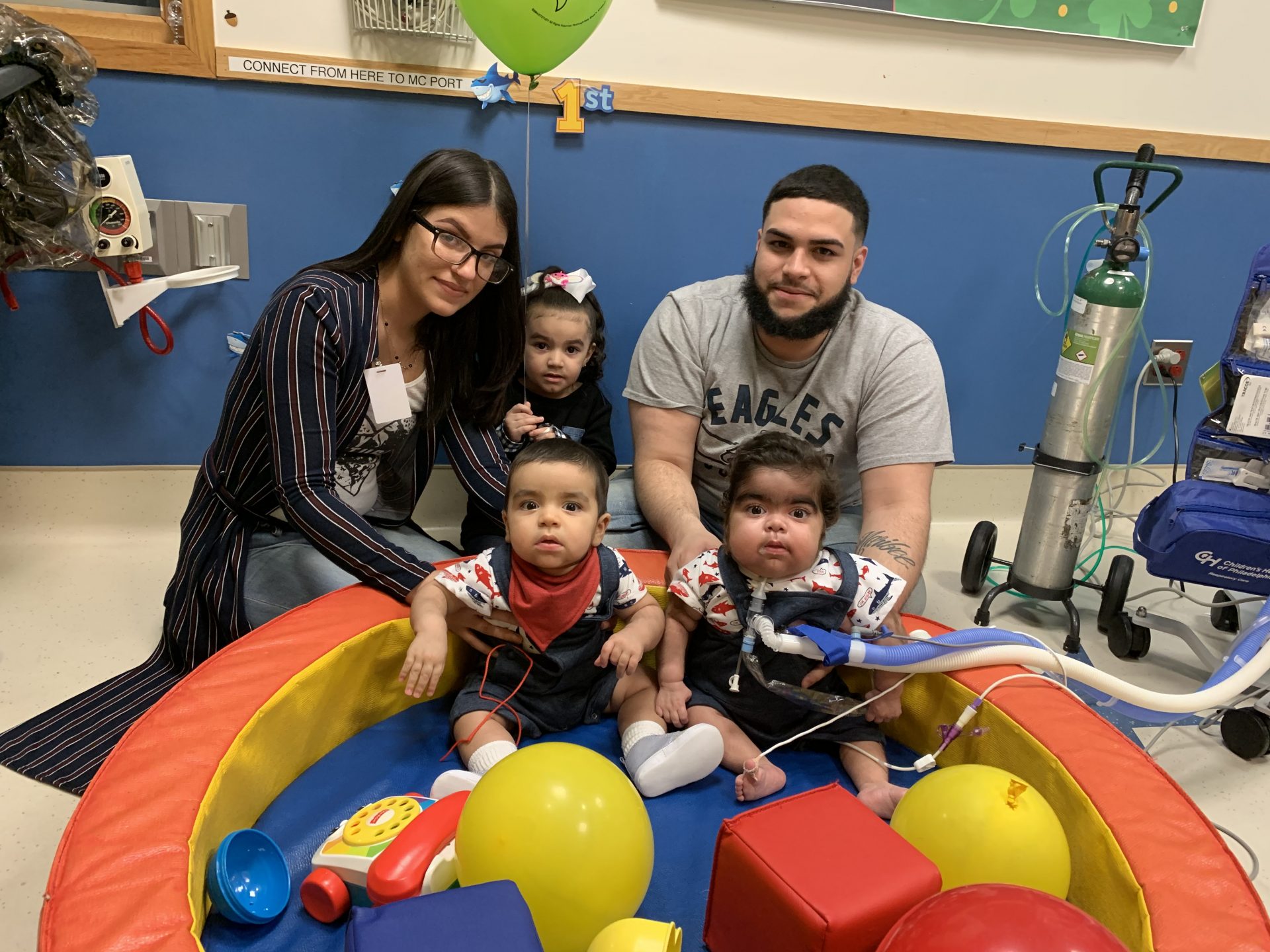 Mother and Father with their children at the Hospital