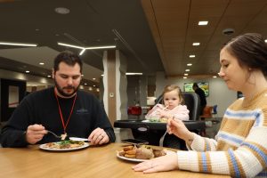 father daughter and mother having dinner at the Ronald McDonald House in Philadelphia