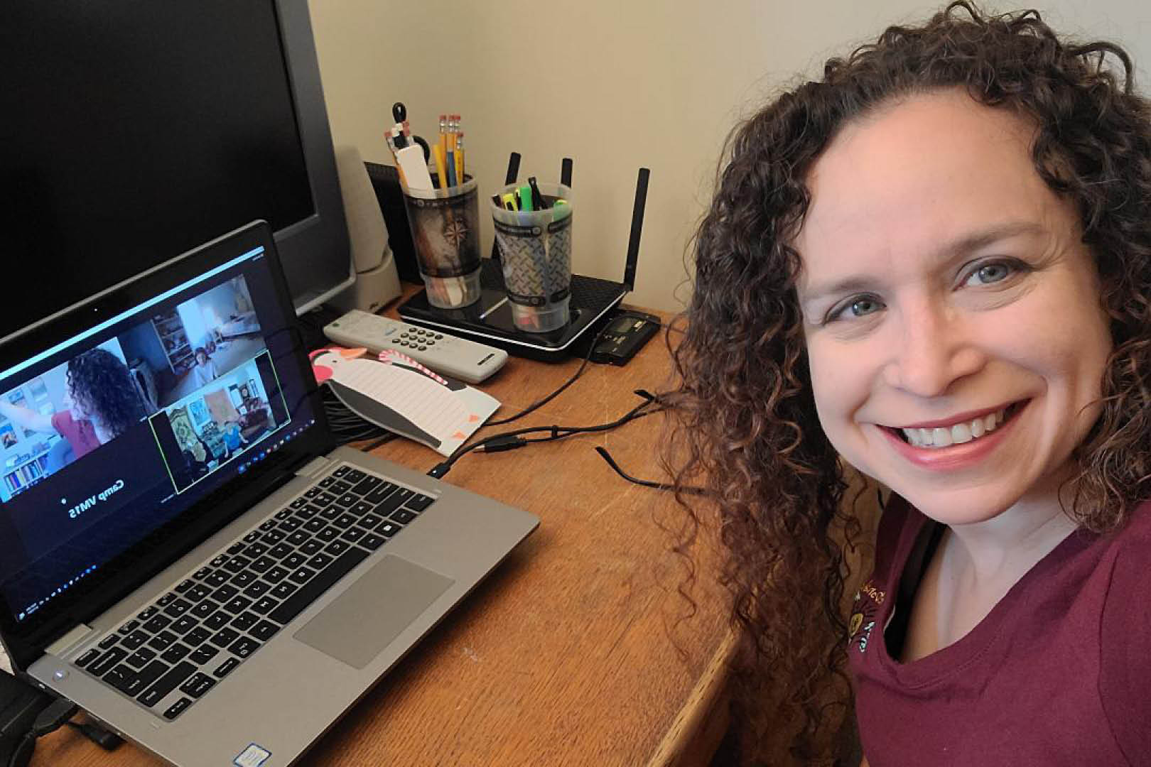 Virtual Camp counselor 3 Volunteer counselor at her desk with camp counselors