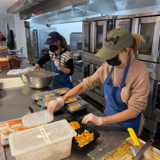 volunteers working in kitchen