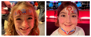 two girls with Phillies face paint