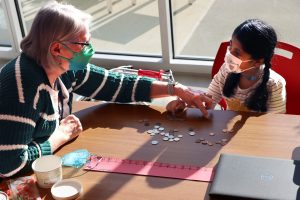 Teacher tutoring guest child