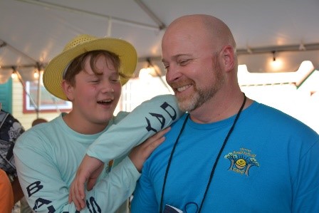 Counselor listens to camper's story