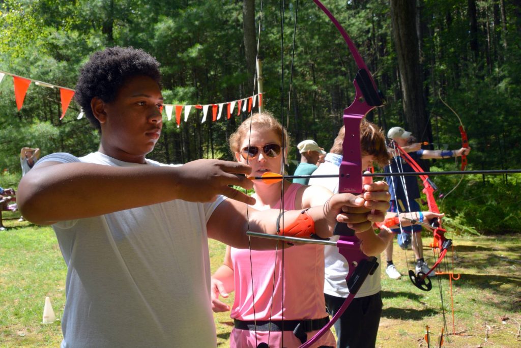 Camper practicing archery