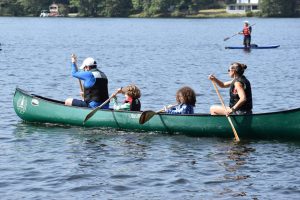 family rowing together