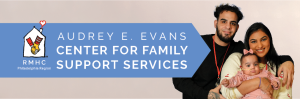 A mother holding a child next to text that says "Audrey E Evans Center for Family Support Services"
